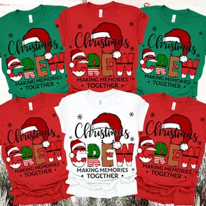 May include: A selection of Christmas t-shirts in red, green, and white. Each shirt displays the words "Christmas Crew" in a festive design, with a Santa hat and snowflake accents. The phrase "Making Memories Together" is also included.