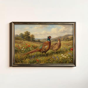 May include: A framed painting of two pheasants in a meadow. The male pheasant displays colourful plumage, including red, green, and brown. The female pheasant is a more subdued brown. The background features rolling hills and a cloudy sky.