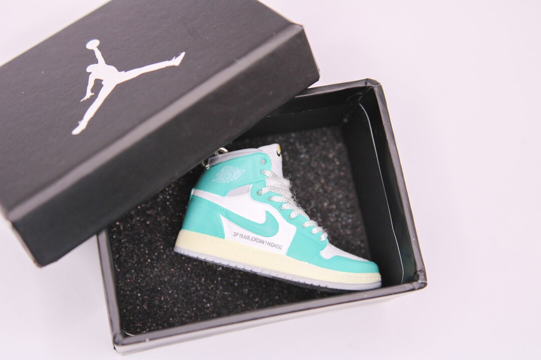 cyan and white jordans