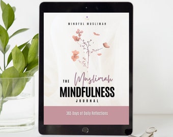 May include: A digital tablet displaying a pink and white cover with the text "The Muslimah Mindfulness Journal" and "365 Days of Daily Reflections". The cover also features a floral design with a branch and pink flowers.