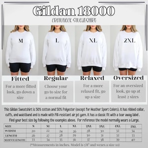 May include: Size chart for Gildan 18000 crewneck sweatshirts. The chart shows the different sizes available, from S to 5XL, and the corresponding measurements in inches for width, length, and sleeve length. The chart also includes information about the fit of each size, such as fitted, regular, relaxed, and oversized.