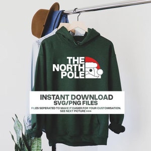 May include: A dark green hoodie with the text "THE NORTH POLE" in white, and a Santa Claus graphic. The hoodie is hanging on a clothing rack. The text "INSTANT DOWNLOAD SVG/PNG FILES" is also visible.