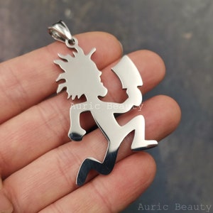 May include: A silver-toned pendant featuring a stylized figure holding an axe. The figure is in a running pose with a mohawk hairstyle.