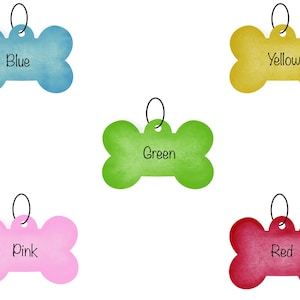 May include: Five dog tags in the shape of bones, each a different color: blue, yellow, green, pink, and red. Each tag has a metal ring and the color name written on it.