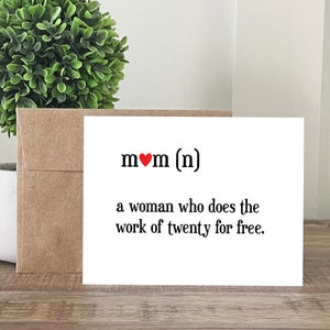 May include: A white card with a red heart and the text "mom (n)" and the definition "a woman who does the work of twenty for free."