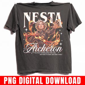 May include: A white ceramic mug with a black handle and the text "But First, Coffee" in a bold, black font. The mug is set against a blurred background, suggesting a cozy setting.