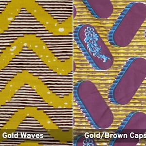 May include: Two fabric swatches with different patterns. The first swatch has a gold background with brown and white stripes forming a wave pattern. The second swatch has a gold background with brown capsules and a blue and white floral design.