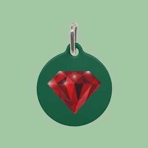 May include: Green round pet tag with a red diamond graphic.