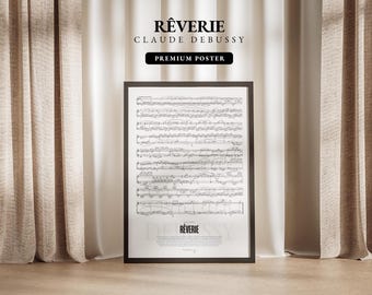 Może przedstawiać: Czarny plakat w ramie z tytułem "Rêverie" Claude'a Debussy'ego. Plakat zawiera nuty z tytułem "Rêverie" na dole. Plakat jest oznaczony jako "Premium Poster".