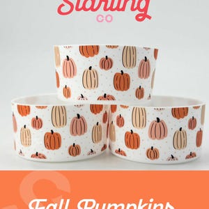 May include: Three white ceramic cups with a pattern of orange and pink pumpkins on a white background. The cups are stacked on top of each other. The text "SWEET STARLING CO" is at the top of the image. The text "Fall Pumpkins" is at the bottom of the image.