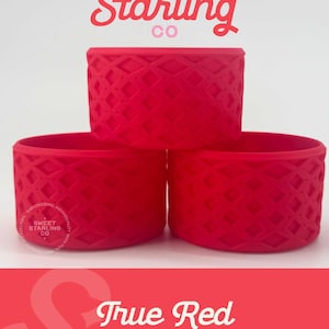 May include: Three true red mini drink sleeves with a diamond pattern are stacked. The top of the image has the text "Sweet Starling Co" in pink and red. The bottom of the image has the text "True Red MINI".
