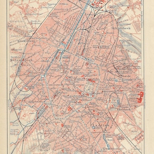 Peut inclure: Ancienne carte de Bruxelles, Belgique, avec un plan de rues détaillé en rouge et noir. La carte comprend du texte en allemand, une échelle de 1:40 000 et une légende. Imprimée sur du papier vieilli.