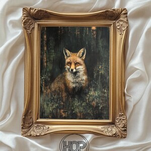 May include: A framed print featuring a fox in a forest setting. The artwork is in a gold ornate frame. The fox has reddish-brown fur and is surrounded by green foliage. The print is from Happyology Prints.