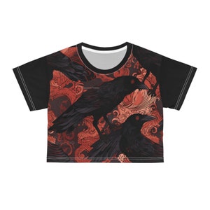 May include: Black crop top with a red and black pattern of crows and floral designs.