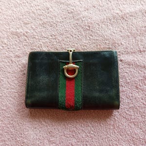 Vintage Gucci Portemonnaie 70er Jahre aus schwarzem Leder Horsebit Logo Stripe Italy