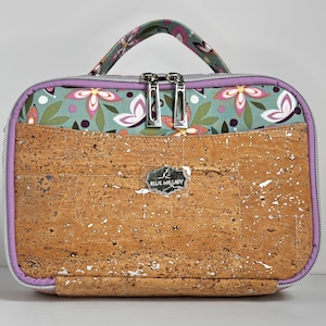 Dual compartment, rectangular zippered handbag with multiple storage pockets