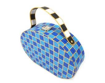 May include: A blue and gold checkered oval-shaped handbag with a black and white striped handle.