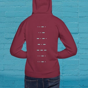 May include: A maroon hoodie with a light blue design on the back. The design is a series of dashes in a vertical line.