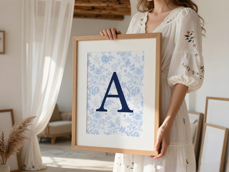 Balance your relaxing safe haven vibe by styling our cozy reading nook wall art with this custom college dorm gallery wall set digital download. This aesthetic room decor strategy blends a warm minimalist illustration with this blue preppy university, floral initial, and state map poster. Perfectly capturing the slow living and grandmillennial interior design trends, this printable gallery wall offers grounded optimism. Deliver massive emotional utility and a chic ambiance to your teen bedroom.