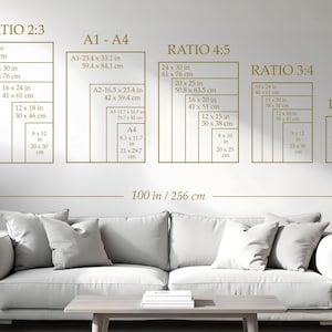 A wall-mounted display showcasing various print sizes and aspect ratios, including 24 x 36 inches, 20 x 30 inches, and 16 x 24 inches. The text "RATIO 2:3", "A1-A4", "RATIO 4:5", "RATIO 3:4", and "11x14" are visible. A sofa and table are in the foreground.