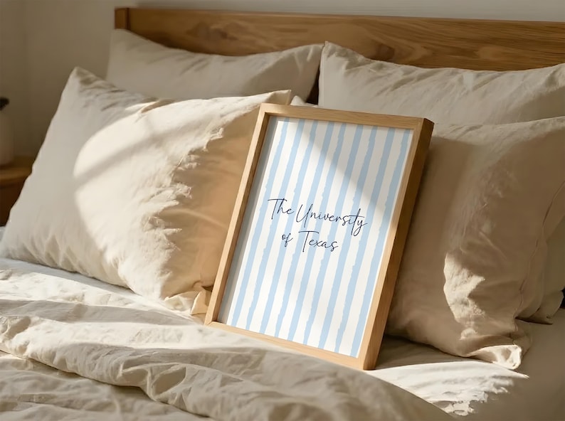 Elevate your aesthetic college dorm room decor with this custom blue preppy gallery wall set of three. Featuring a personalized university name poster, a floral initial monogram, and a delicate state map print. This digital download perfectly captures the highly sought after coastal granddaughter and grandmillennial interior design trends. An incredible printable high school graduation gift for teen girls, offering immense emotional utility and a beautifully cohesive living space sanctuary.