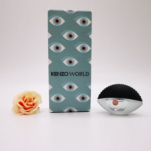Kenzo World MINIATURE perfume. 5ml / 0.16 fl. oz. EDP. Splash, not spray.  Collectible. Rare and discontinued. 100% authentic.