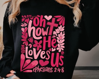 May include: Black sweatshirt with a pink and red graphic design that says "Oh how He loves us Ephesians 2:4-8".
