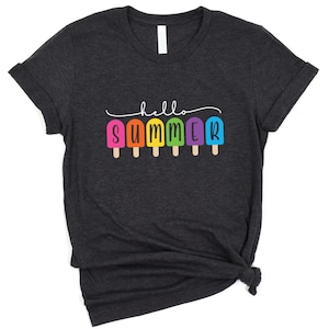 May include: A dark gray t-shirt with the text "hello summer" in black lettering. The text is surrounded by a row of colorful popsicle graphics.