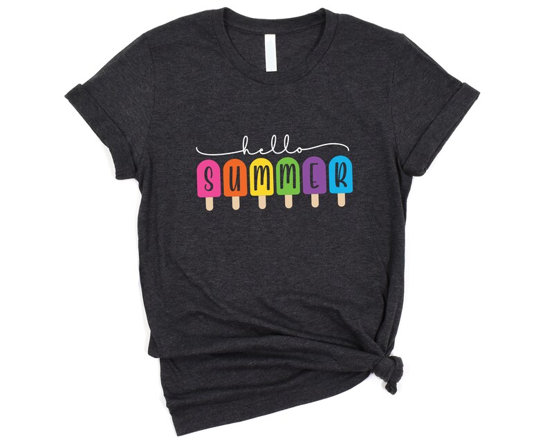 May include: A dark gray t-shirt with the text "hello summer" in black lettering. The text is surrounded by a row of colorful popsicle graphics.