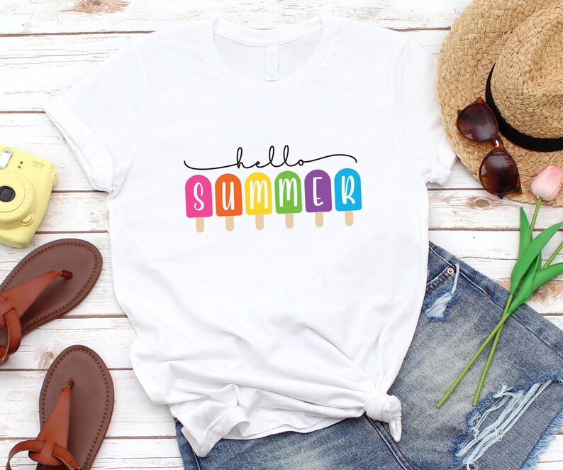 May include: White t-shirt with the text "hello summer" and colorful popsicle graphics.