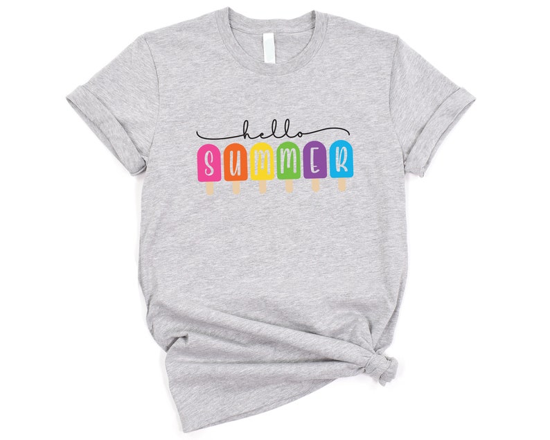 May include: Gray t-shirt with the text "hello summer" in a black script font. The word "summer" is spelled out with colorful popsicle graphics.