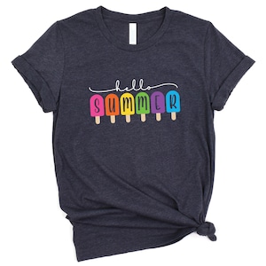 May include: A dark blue t-shirt with the text "hello summer" and a row of colorful popsicle graphics.