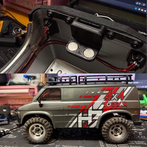 May include: A detailed image of a gray and red 4x4 Lockman model van with a black roof rack and large off-road tires. The top section shows internal components with wires and a magnetic component.