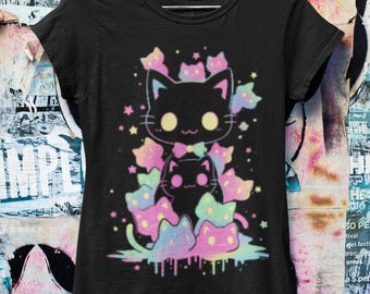 May include: Black t-shirt with a graphic print of a stack of black cats with pastel rainbow colors and stars. The cats have big eyes and are wearing bows.