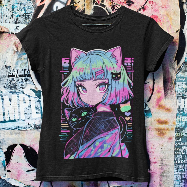 May include: Black t-shirt with a colorful anime-style illustration of a girl with blue hair and cat ears. She is holding a black cat with green eyes. The design includes a rainbow and hearts.