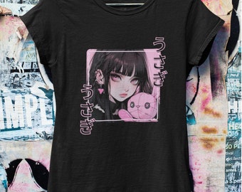 May include: Black t-shirt with a pink graphic of an anime girl with black hair and a pink stuffed animal. The text "うさぎ" is written on the left and right sides of the graphic.