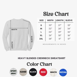 May include: A white crewneck sweatshirt with a size chart showing measurements in inches. The chart lists sizes S to 2XL, with widths from 20" to 28", lengths from 27" to 31", and sleeve lengths from 33" to 37". A color chart displays options including sport gray, sand, black, red, white, and royal blue.