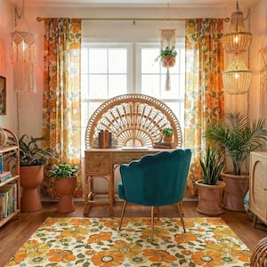 May include: A cozy, bohemian-style room with a floral rug, orange curtains, and a teal velvet chair. The room features a rattan desk, a large wicker headboard, and hanging macrame plant holders. Decorative lamps and potted plants add to the warm atmosphere.