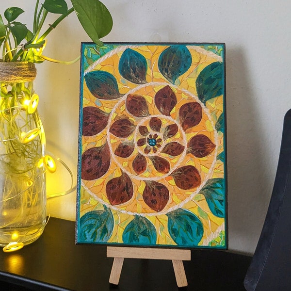 Abstract acrylic painting on a wooden base featuring a swirl leaf vine design.