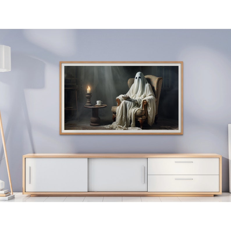 May include: A white ghost figure sitting in a brown armchair, reading a book. The ghost is wearing a white sheet and has two black eyes. The armchair is in a dimly lit room with a candle on a small table next to it.