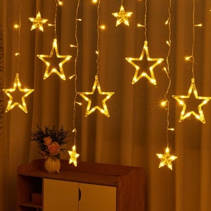 Stringa di luci a LED-Stringa di stelle-Luci da fata per decorazioni domestiche esterne e interne-Luci a sospensione a stella scintillante per l'arredamento della camera immagine 9