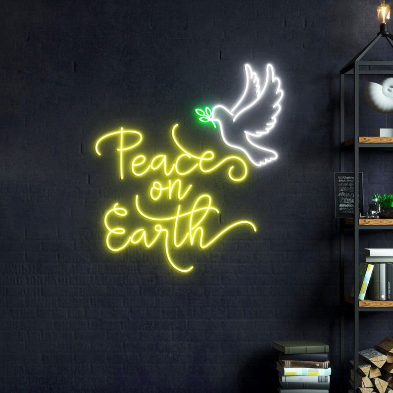 May include: A neon sign with a white dove holding a green olive branch and the words "Peace on Earth" in yellow neon.