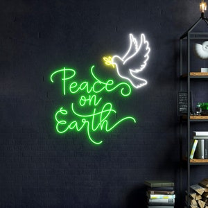 May include: Green neon sign with the words "Peace on Earth" in a cursive font. A white neon dove with a yellow olive branch in its beak is above the words.