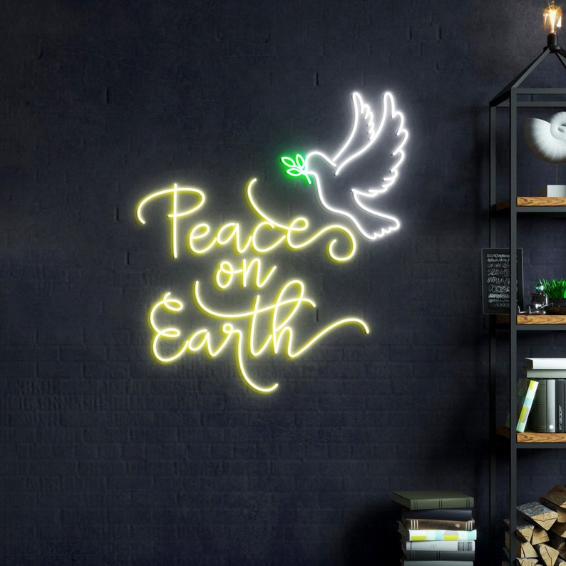 May include: A neon sign with a white dove carrying a green olive branch and the text "Peace on Earth" in yellow neon.
