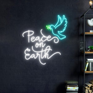 May include: White neon sign with the text "Peace on Earth" and a blue neon dove with a green olive branch in its beak.