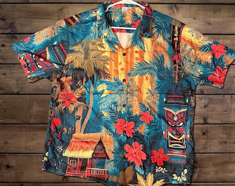 Camisa hawaiana Tiki Hut: Camisa hawaiana con estampado retro de selva, máscara tribal y palmeras