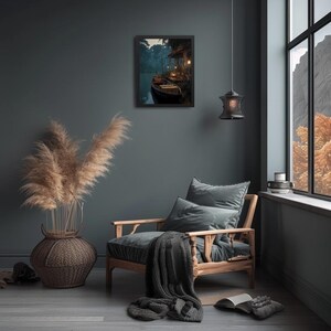 May include: A framed print of a boat on a river at dusk hangs on a dark teal wall. A wooden armchair with gray cushions and a blanket sits nearby. A large woven vase with tall, dried grasses is on the left.