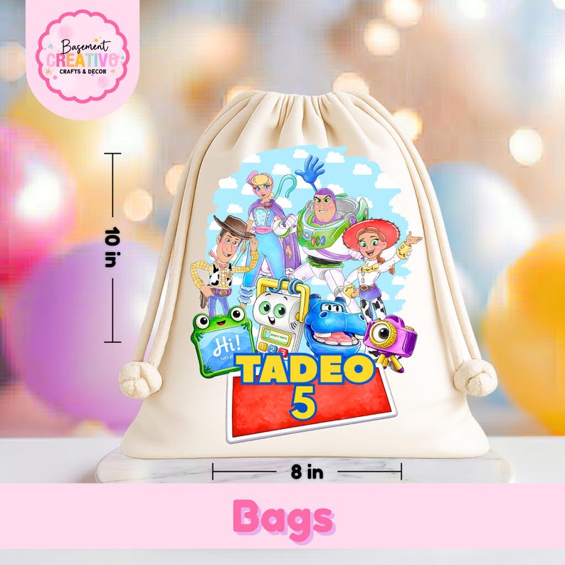 May include: A cream-colored drawstring backpack featuring a colorful graphic of various animated characters, including a cowboy, a space ranger, and a cowgirl. The name TADEO and the number 5 are printed in bold yellow and blue. It measures 10 inches by 8 inches.