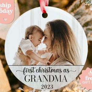 a christmas ornament with a picture of a woman holding a baby