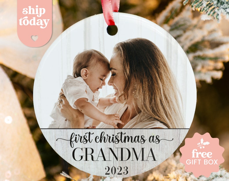 a christmas ornament with a picture of a woman holding a baby